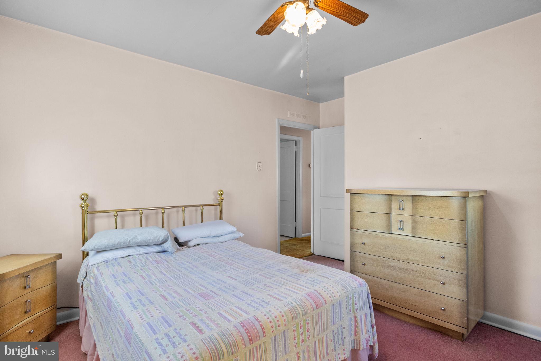 3731 Dresher Road Bensalem, PA 19020 - Photo 13 of 21 a bedroom with a bed and a chandelier