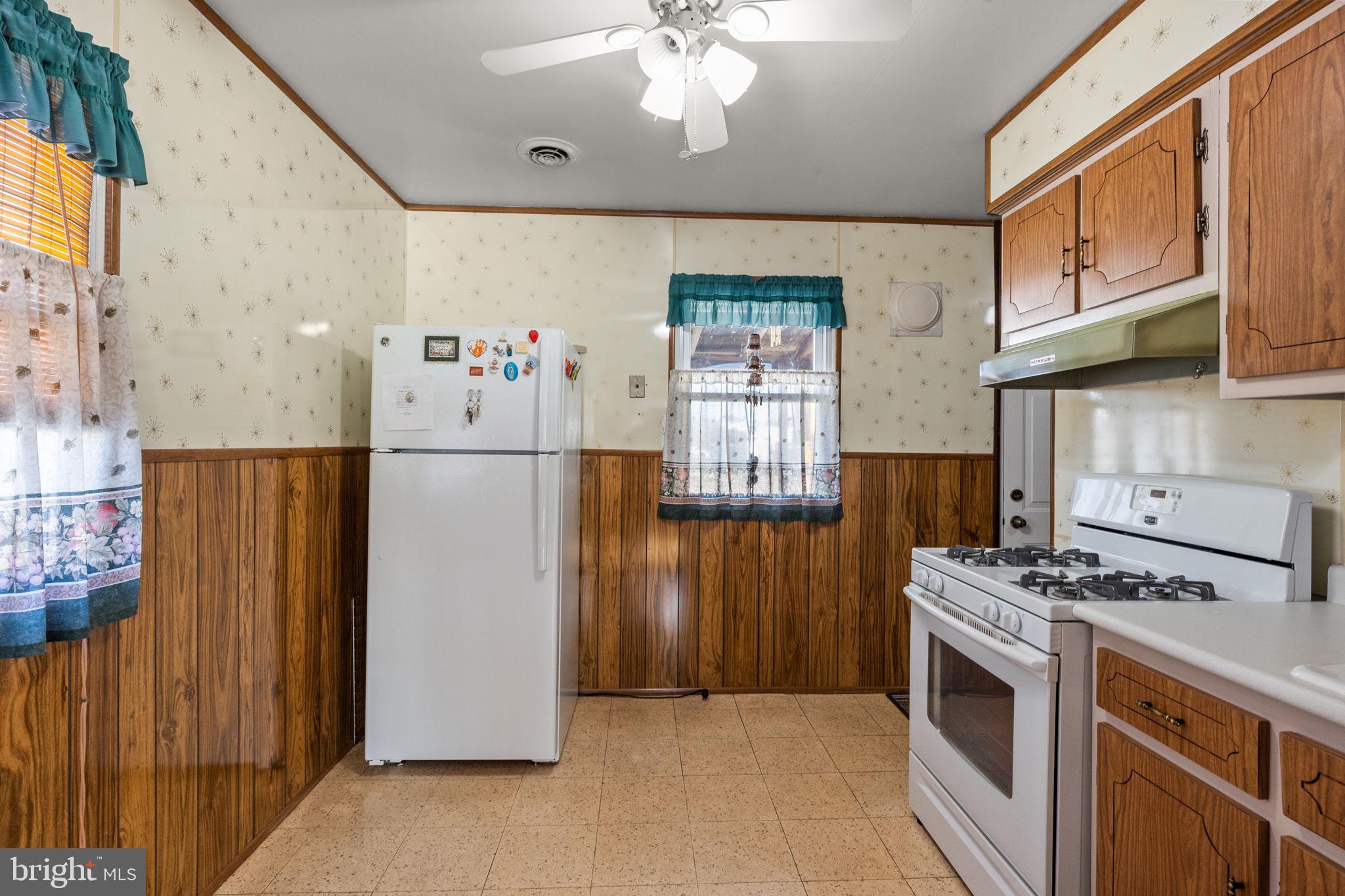 3731 Dresher Road Bensalem, PA 19020 - Photo 8 of 21 a kitchen with stainless steel appliances granite countertop a refrigerator a stove and a sink
