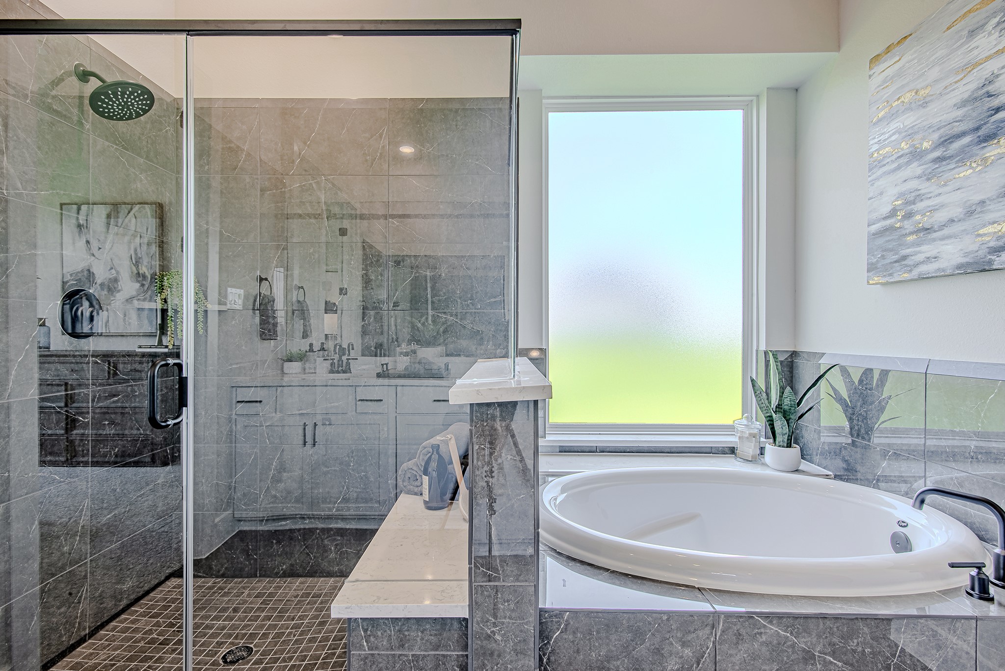 141 Peninsula Point Drive Montgomery, TX 77356 - Photo 23 of 47 Enjoy spa-like luxury with a deep soaking tub and a sleek glass-enclosed shower wrapped in rich stone tile.