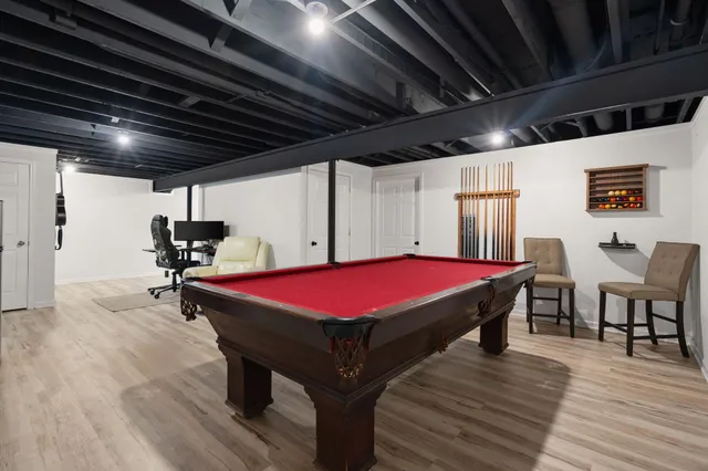 a room with furniture and pool table
