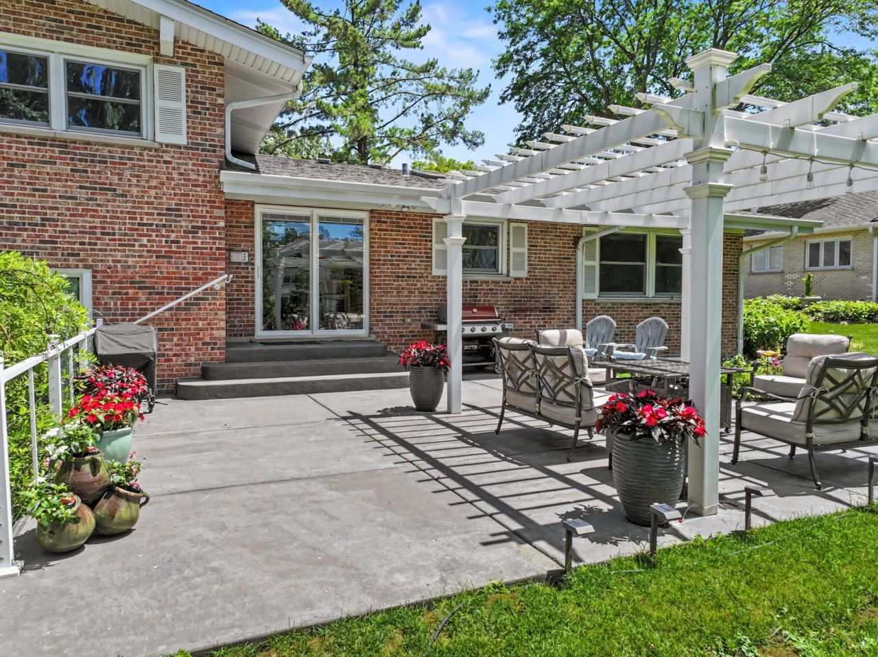 328 Windsor Lane Inverness, IL 60010 - Photo 27 of 33 a front view of a house with a porch and garden
