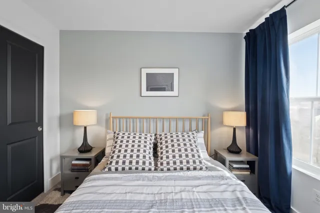 a bedroom with furniture and a window