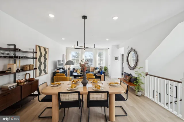 a living room with lots of furniture and a chandelier