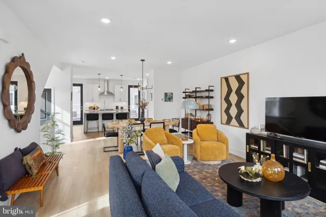 a kitchen with granite countertop a center island stainless steel appliances and cabinets