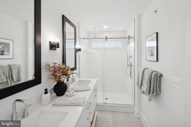 a bathroom with a shower and a sink