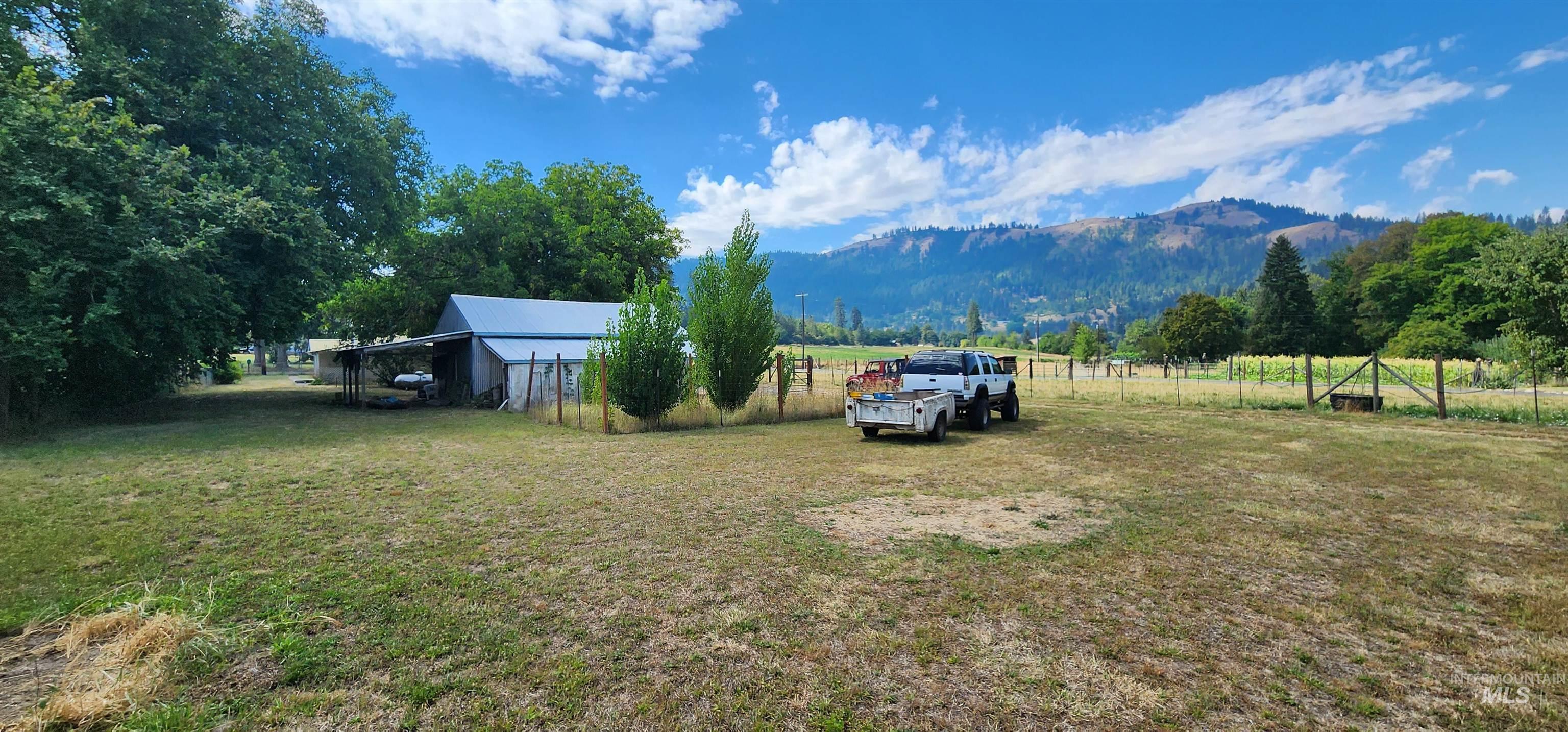 126 Rock Road Kamiah, ID 83536 - Photo 11 of 35 View of yard featuring a view of countryside, a mountain view, and an outbuilding