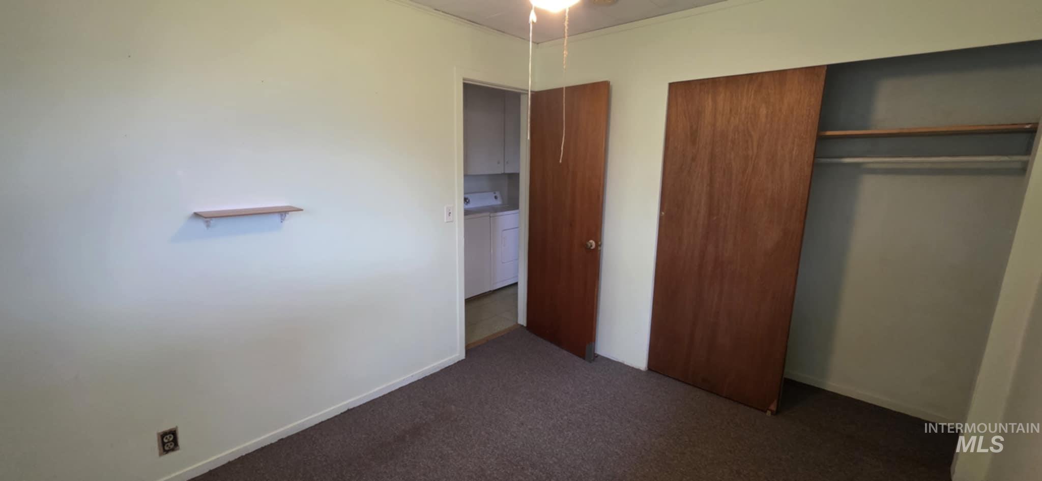 126 Rock Road Kamiah, ID 83536 - Photo 29 of 35 Unfurnished bedroom with washer / dryer, carpet flooring, and a closet