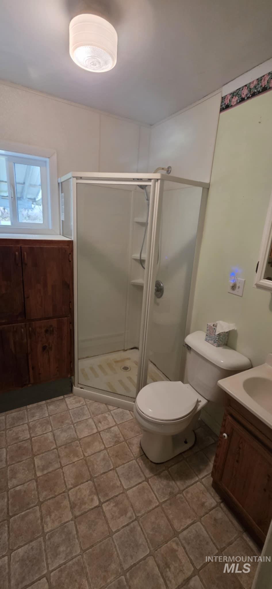 126 Rock Road Kamiah, ID 83536 - Photo 30 of 35 Bathroom featuring vanity and a stall shower