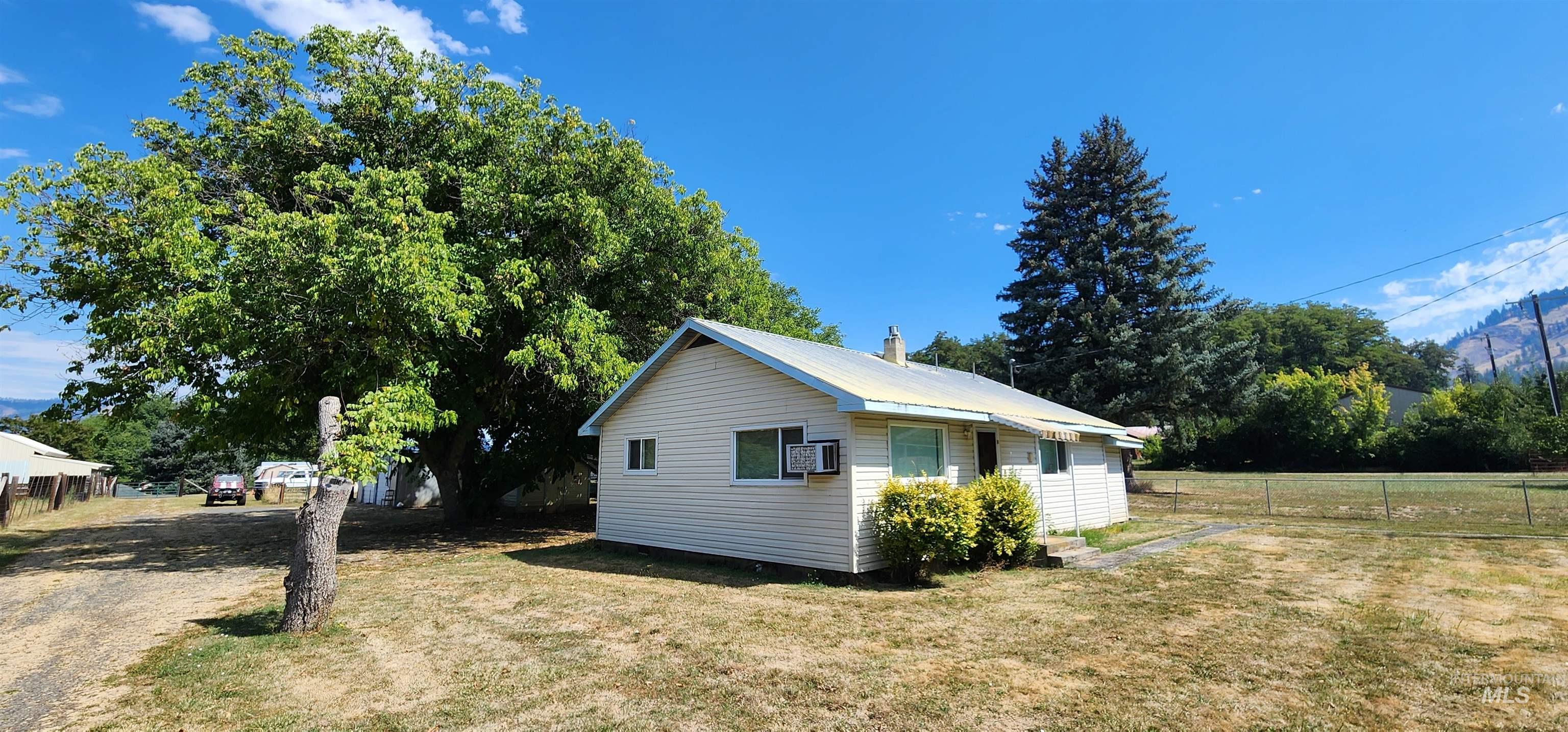 126 Rock Road Kamiah, ID 83536 - Photo 33 of 35 View of property exterior featuring a metal roof