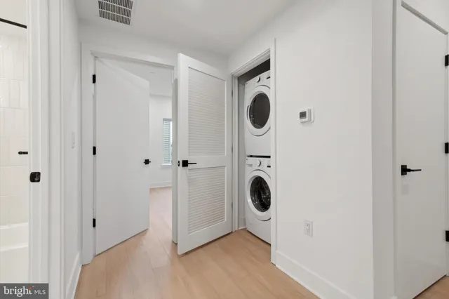 a view of a storage & utility room with dryer and washer