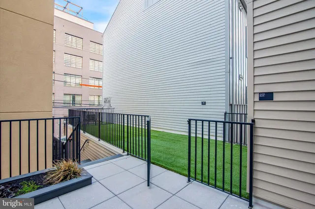 a view of a balcony with a potted plant