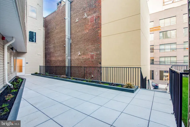 a view of a balcony with a bench