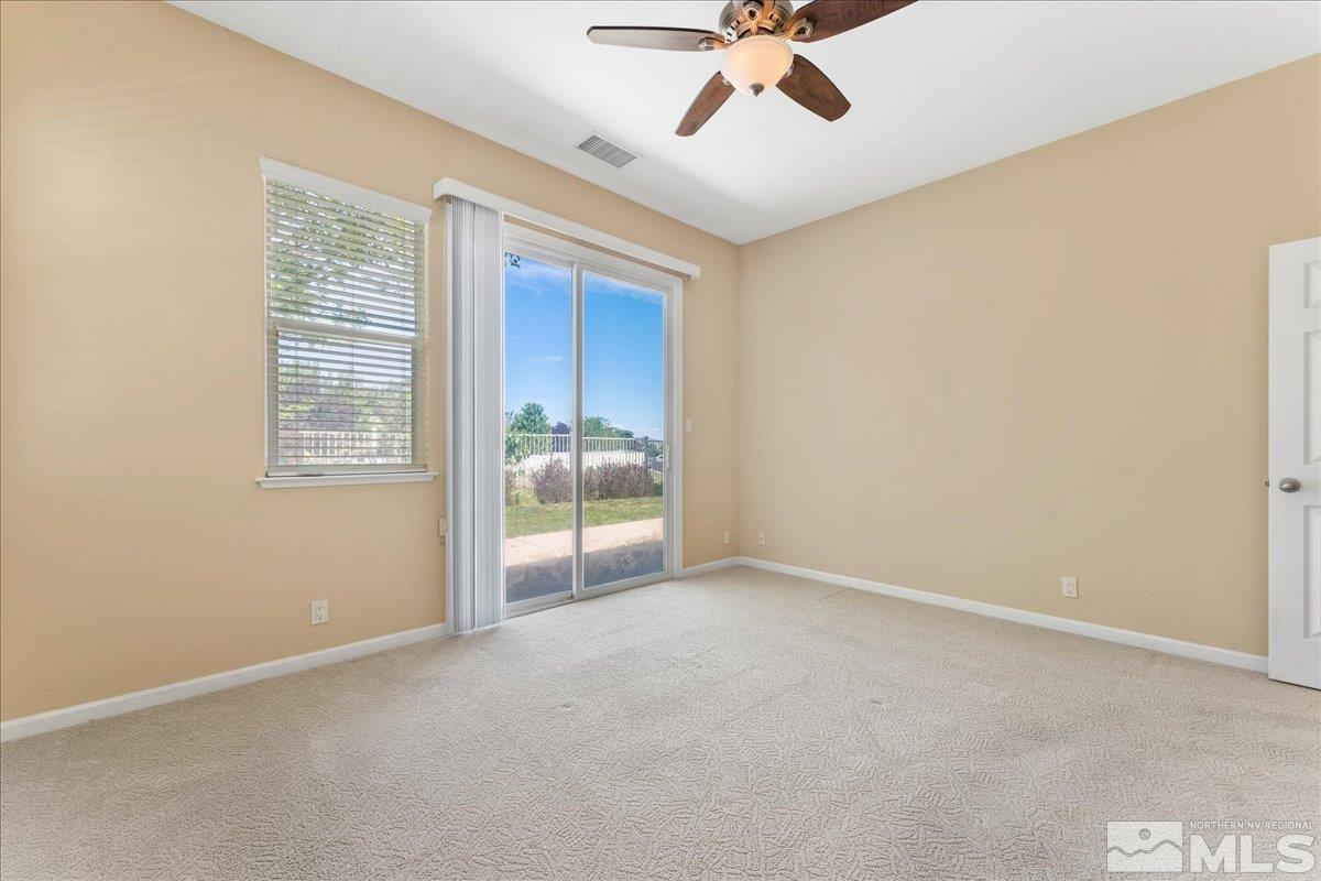 10707 Grayslake Drive Reno, NV 89521 - Photo 10 of 37 a view of an empty room with a window