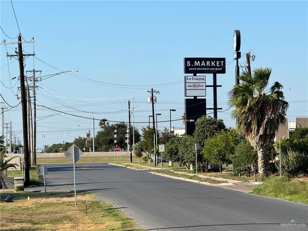 0 South Bentsen Road McAllen, TX 78503 - Photo 6 of 13 a view of a swimming pool with a yard and palm trees