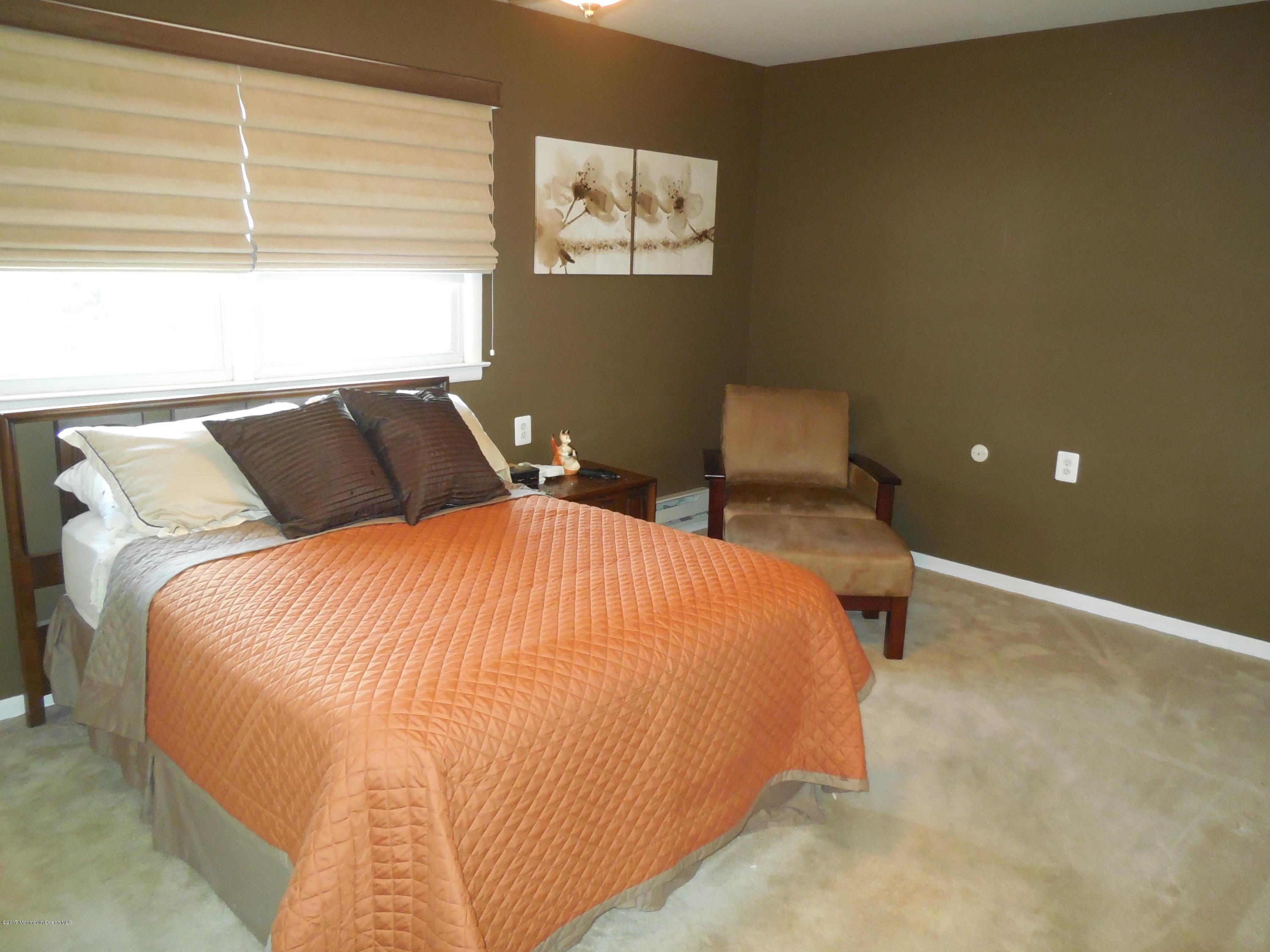 26 Phillips Road Brick, NJ 08724 - Photo 11 of 16 a bedroom with a bed and wall painting