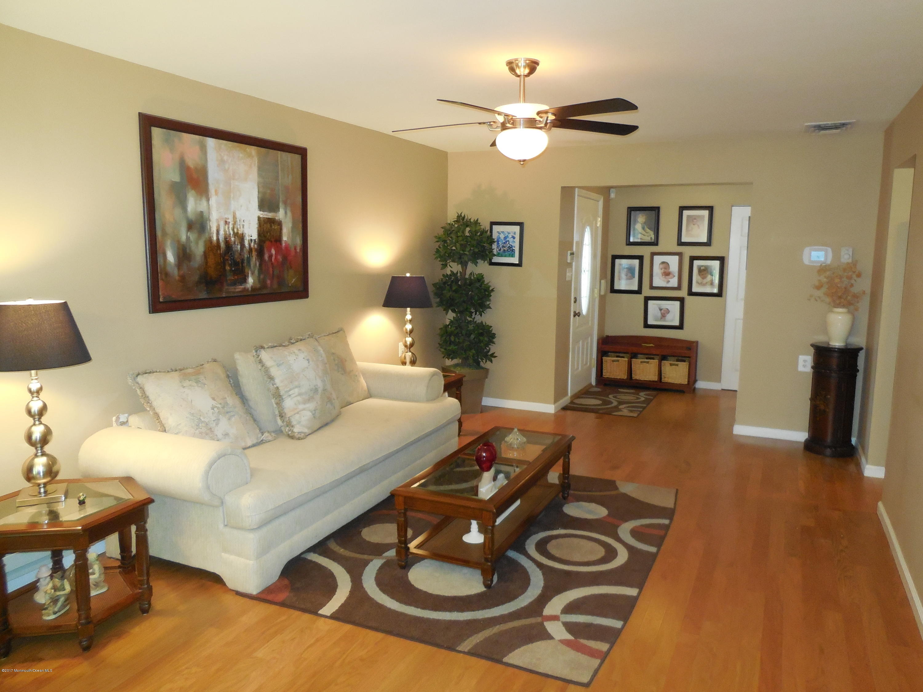 26 Phillips Road Brick, NJ 08724 - Photo 3 of 16 a living room with furniture and a wooden floor