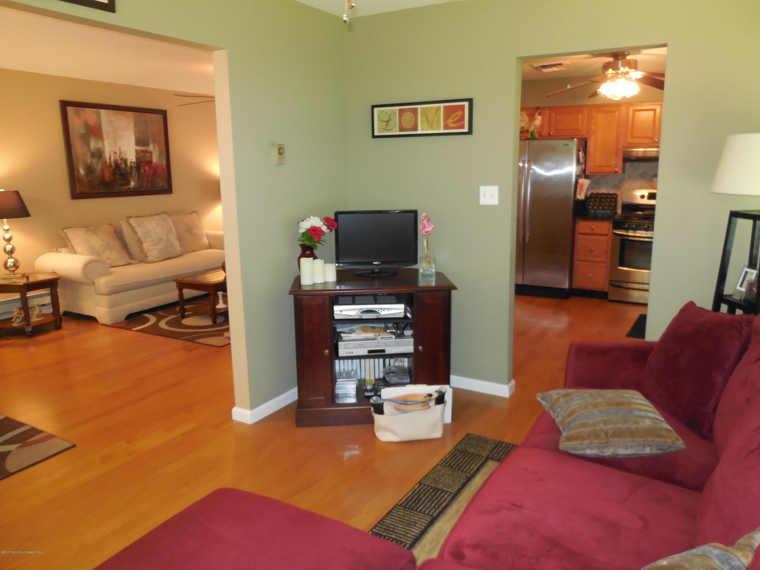 26 Phillips Road Brick, NJ 08724 - Photo 6 of 16 a living room with furniture and a flat screen tv