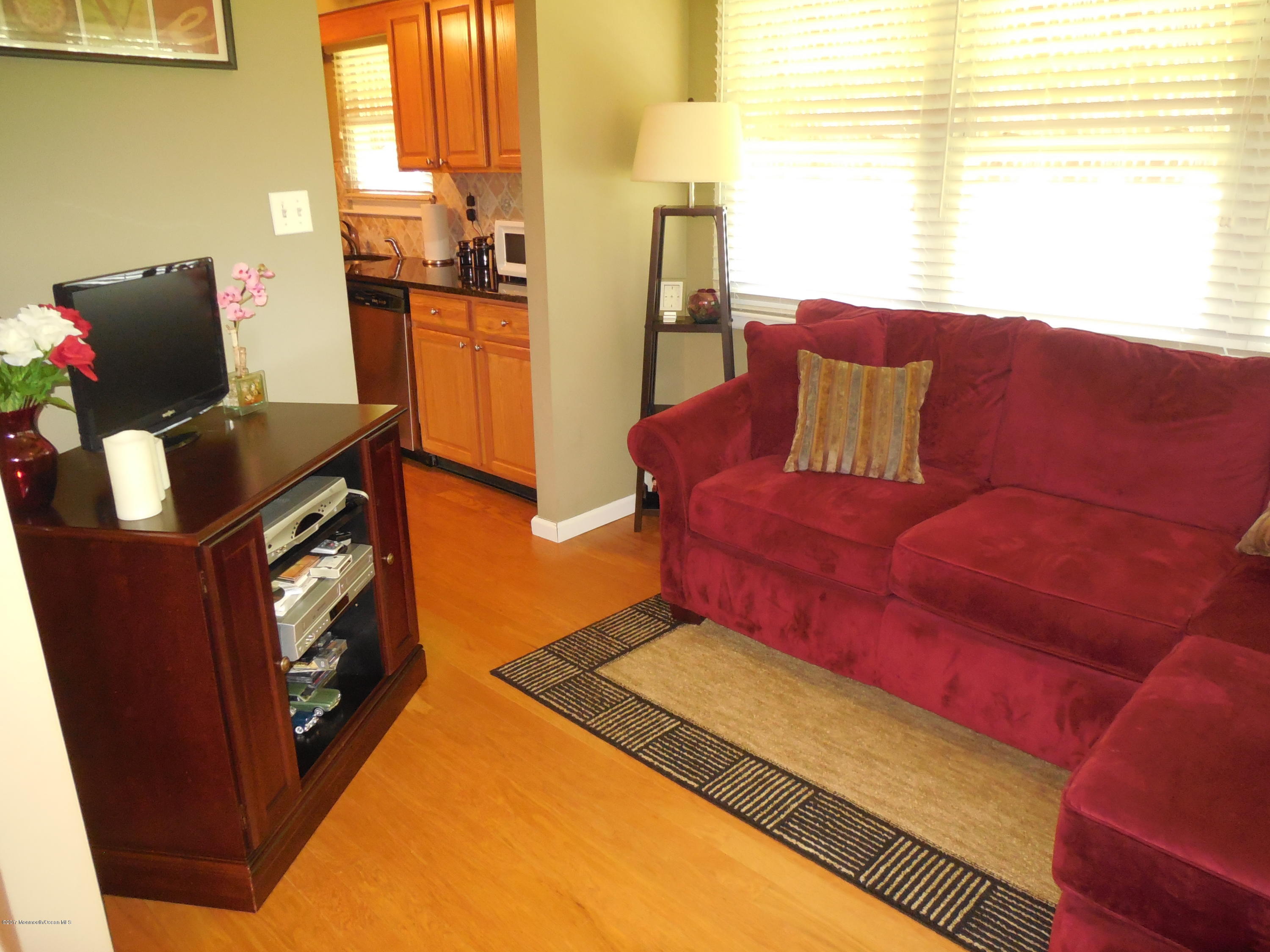 26 Phillips Road Brick, NJ 08724 - Photo 7 of 16 a living room with furniture and a fireplace