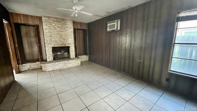 a view of a park with iron fence