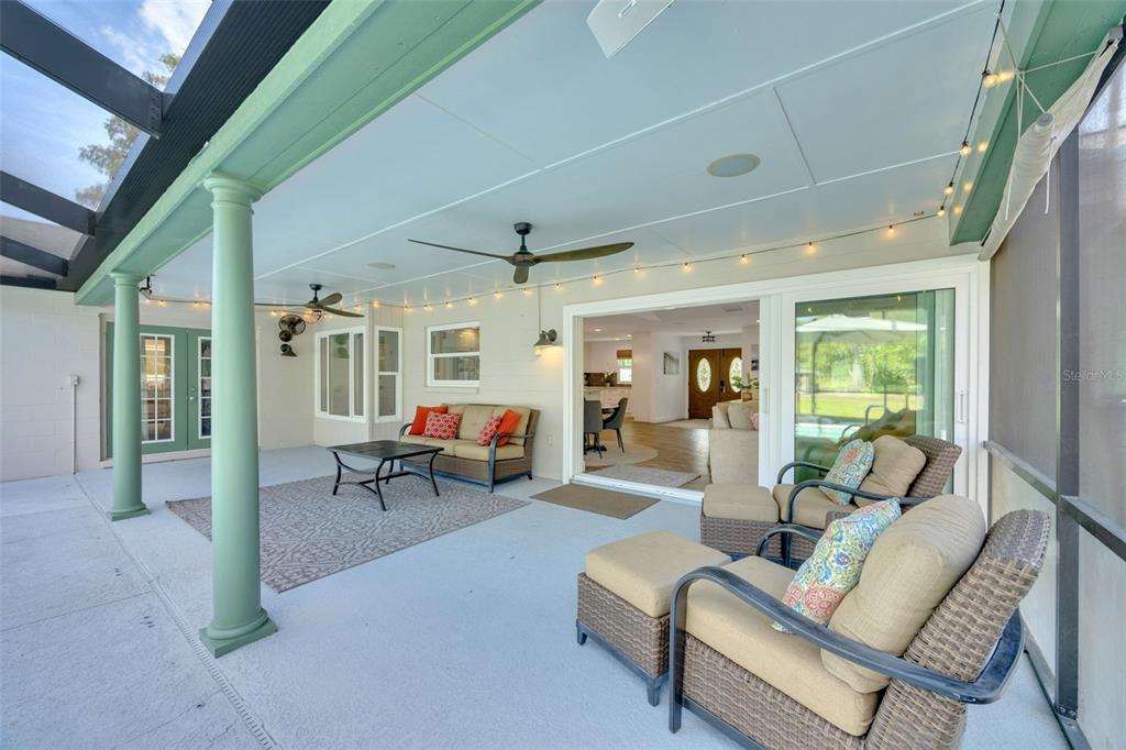 3535 Moores Lake Road Dover, FL 33527 - Photo 42 of 85 Huge, covered back porch with two ceiling fans. The 2 Bose speakers and the hanging lights will stay.