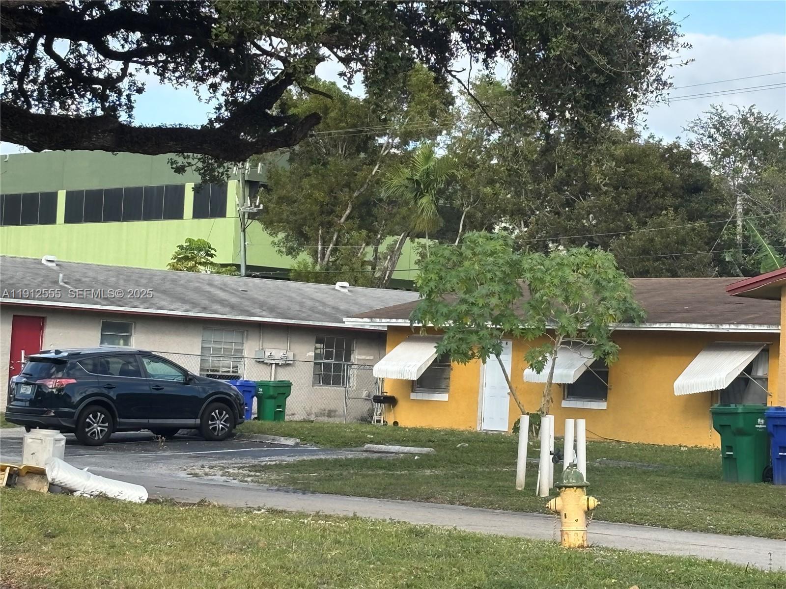 3691 Southwest 60th Terrace Miramar, FL 33023 - Photo 5 of 8 a front view of a house with a yard garage and outdoor seating