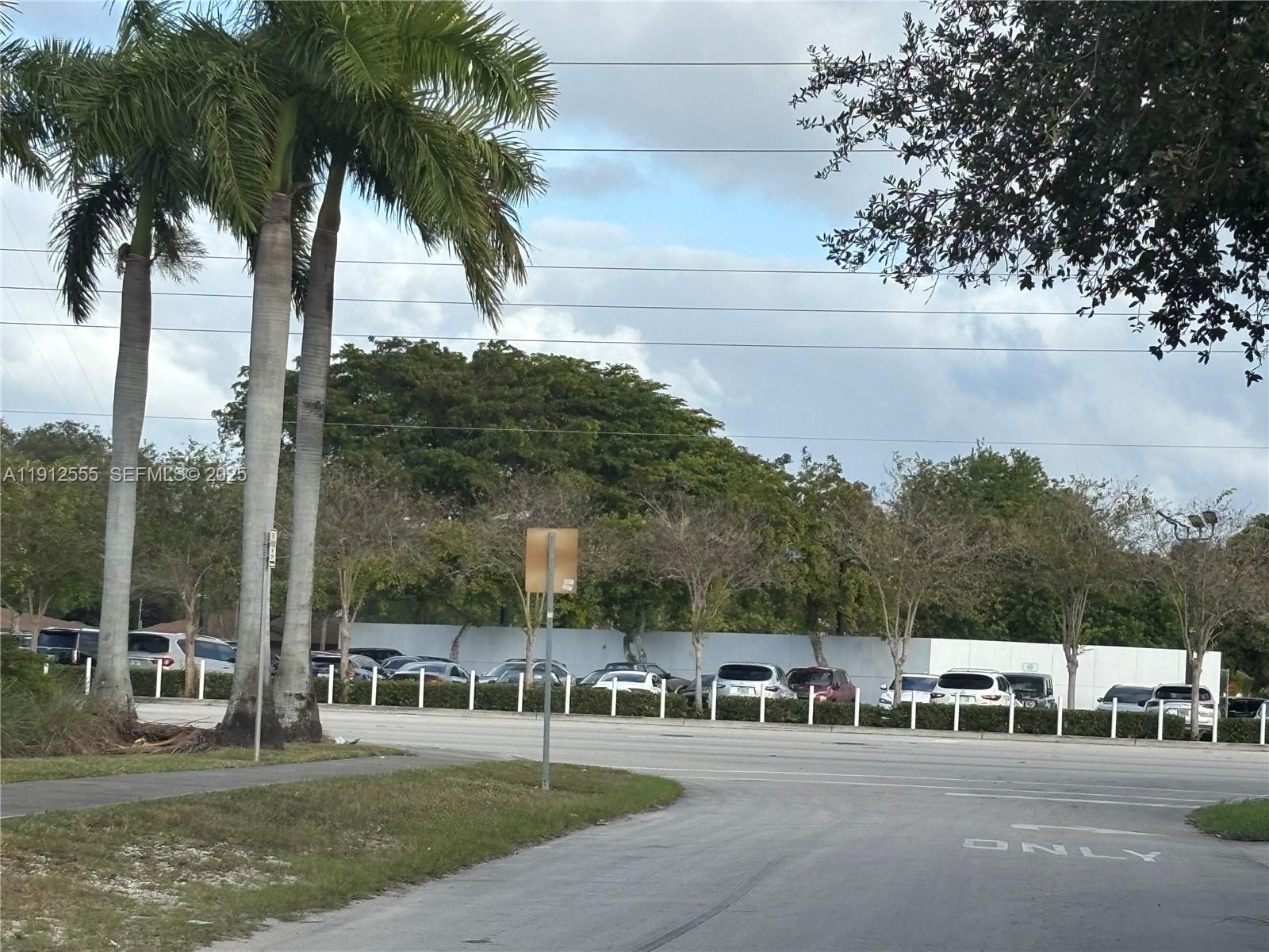 3691 Southwest 60th Terrace Miramar, FL 33023 - Photo 6 of 8 a view of a swimming pool and trees