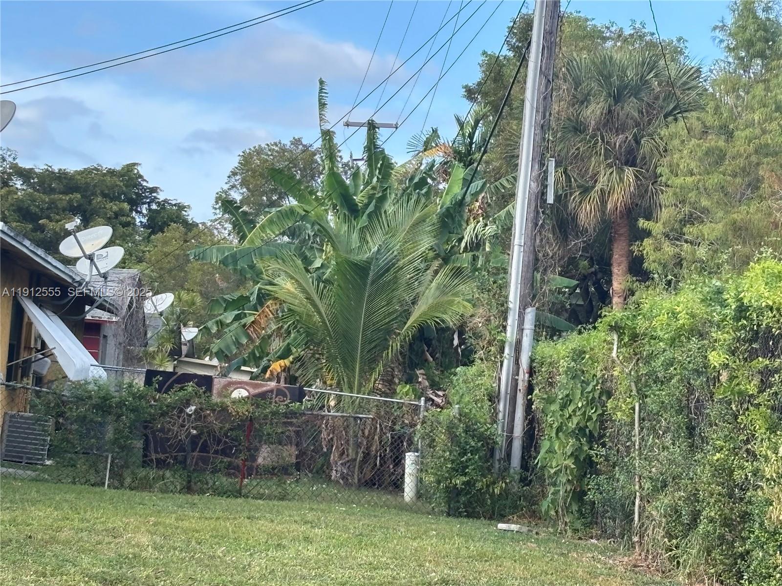 3691 Southwest 60th Terrace Miramar, FL 33023 - Photo 8 of 8 a backyard of a house with lots of green space