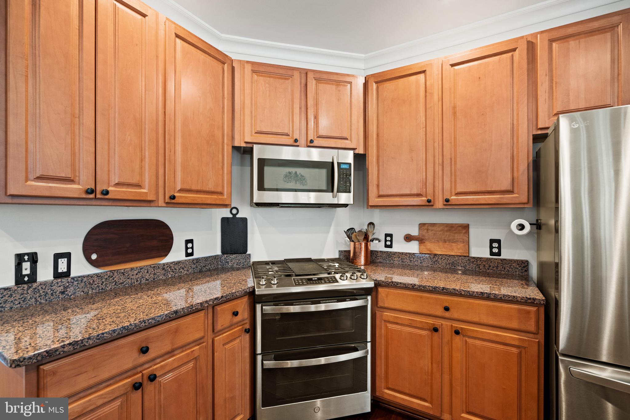 10448 Wheatley School Road Marshall, VA 20115 - Photo 12 of 43 a kitchen with stainless steel appliances granite countertop a refrigerator sink and cabinets