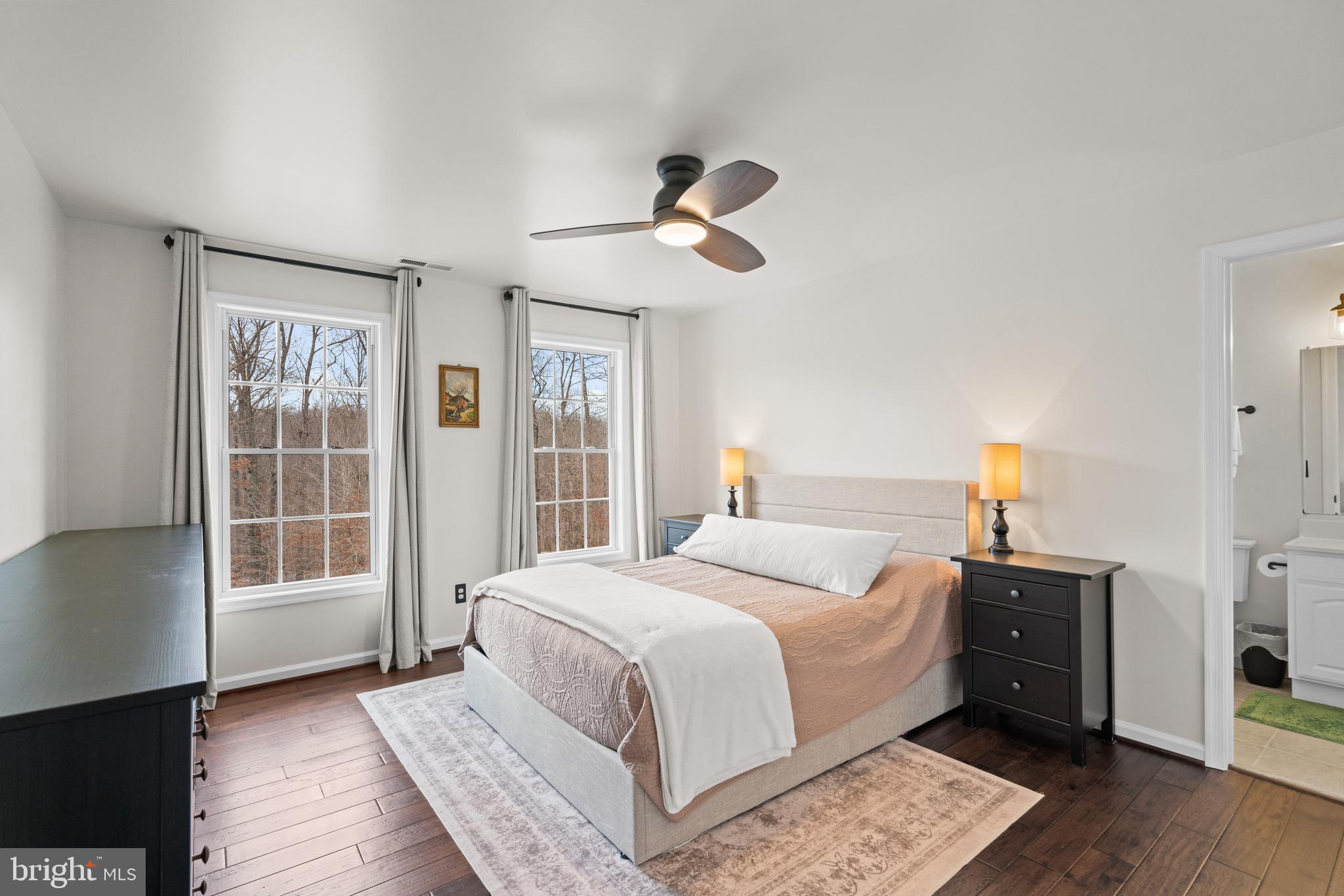 10448 Wheatley School Road Marshall, VA 20115 - Photo 22 of 43 a bedroom with a large bed and a window