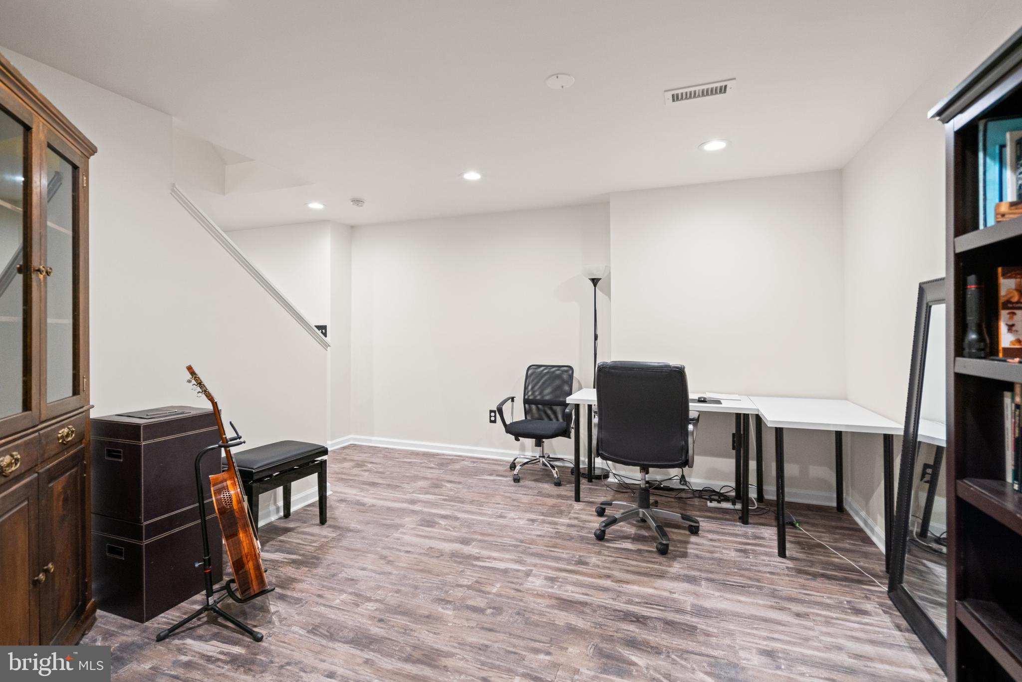 10448 Wheatley School Road Marshall, VA 20115 - Photo 30 of 43 a view of a workspace with furniture and a flat screen tv