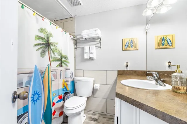 a bathroom with a shower and a toilet