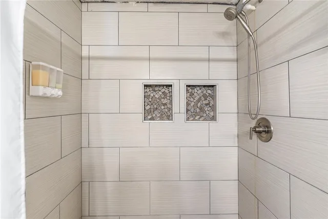 a view of a balcony with chair and wooden floor