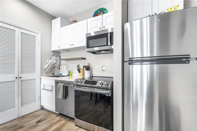 a kitchen with a stove and a microwave
