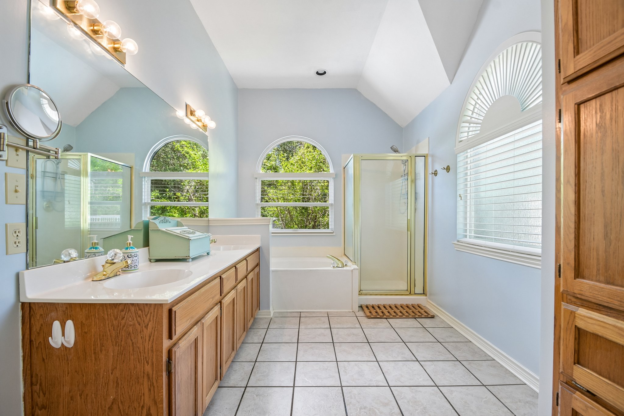3902 Denim Trail Austin, TX 78739 - Photo 16 of 40 Primary bath has tons of natural light with walk in shower and soaking tub