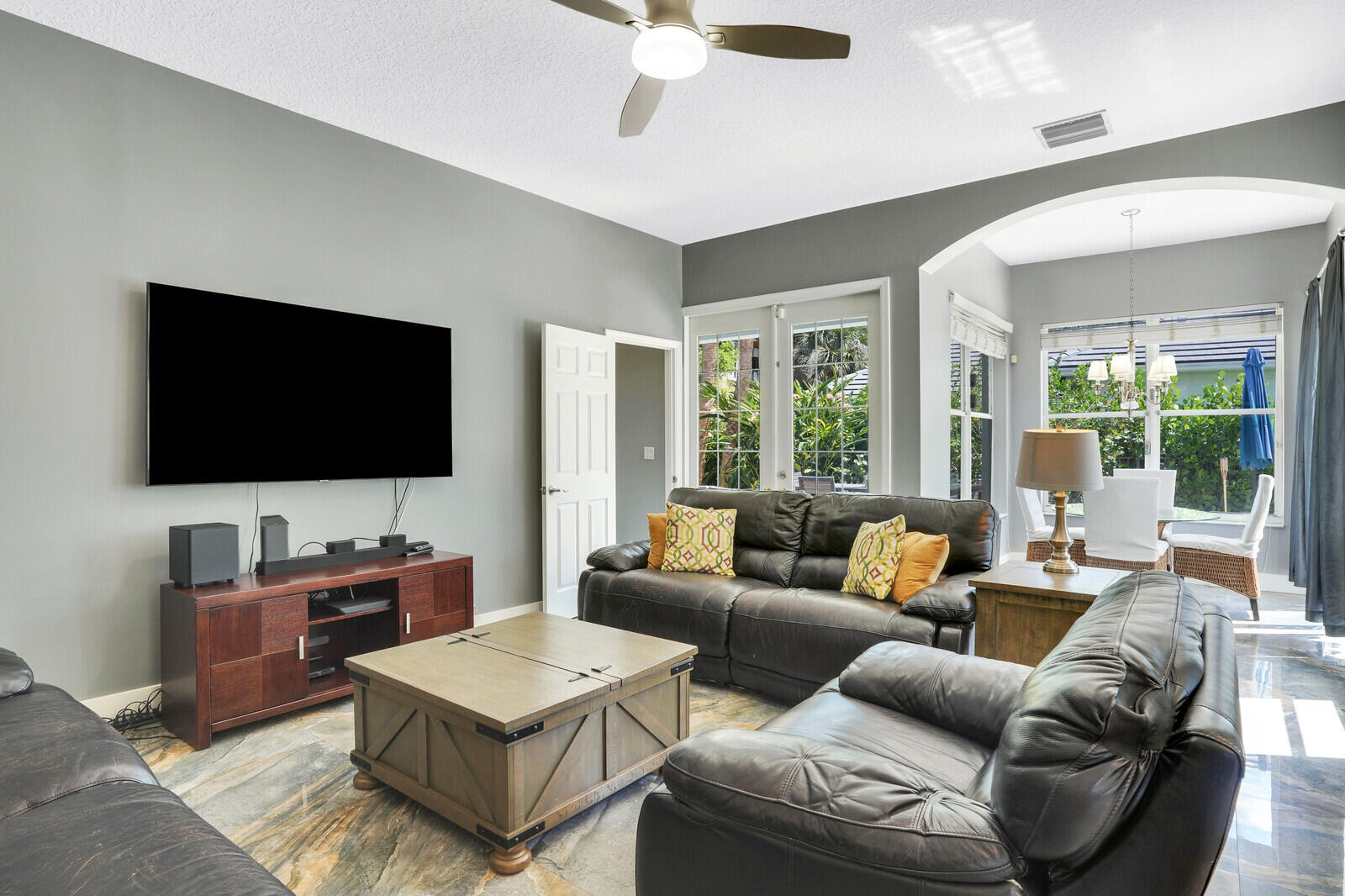 403 Mangrove Point Jupiter, FL 33458 - Photo 16 of 51 a living room with furniture and a flat screen tv