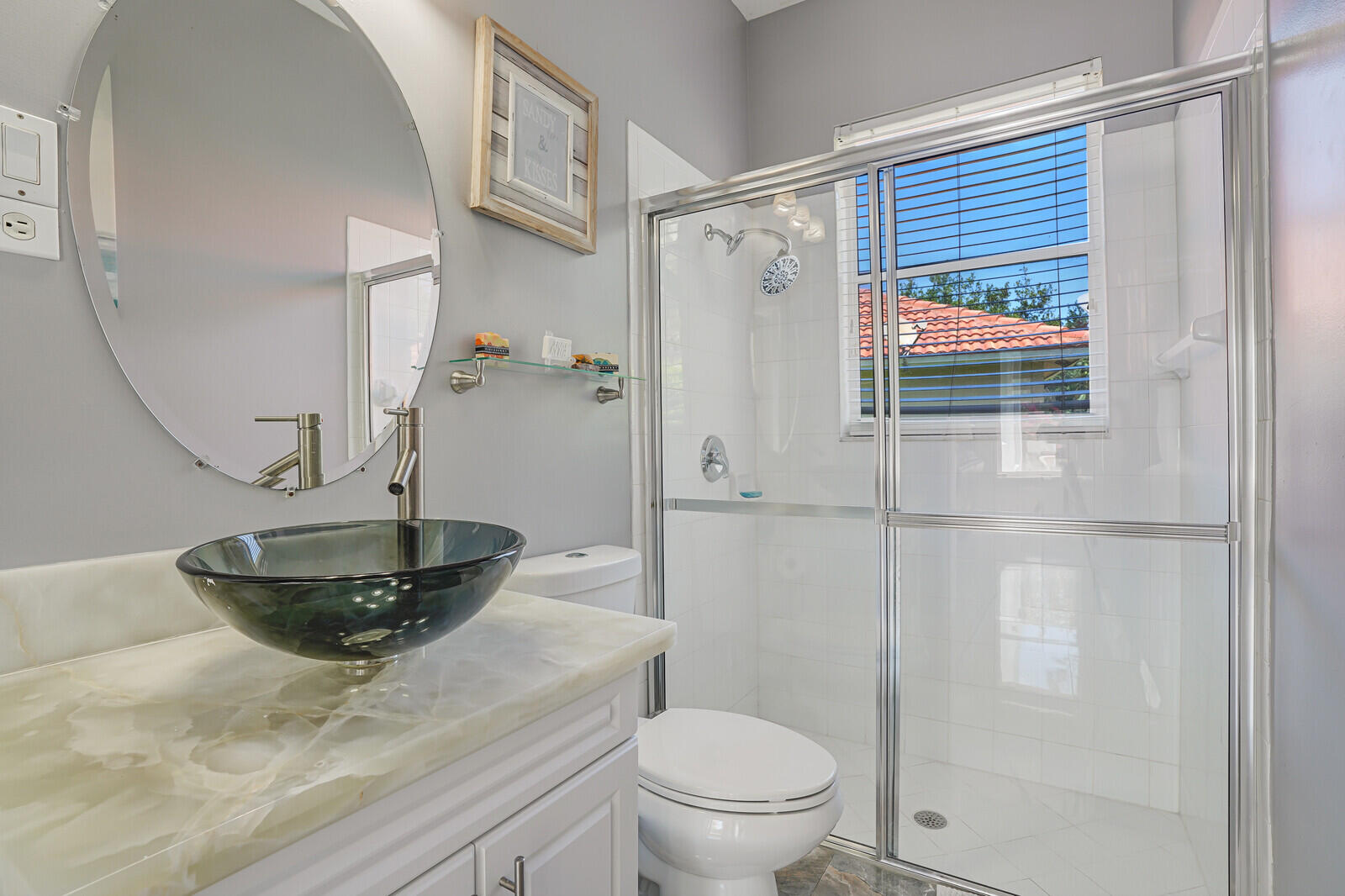 403 Mangrove Point Jupiter, FL 33458 - Photo 20 of 51 a bathroom with a sink a toilet and shower