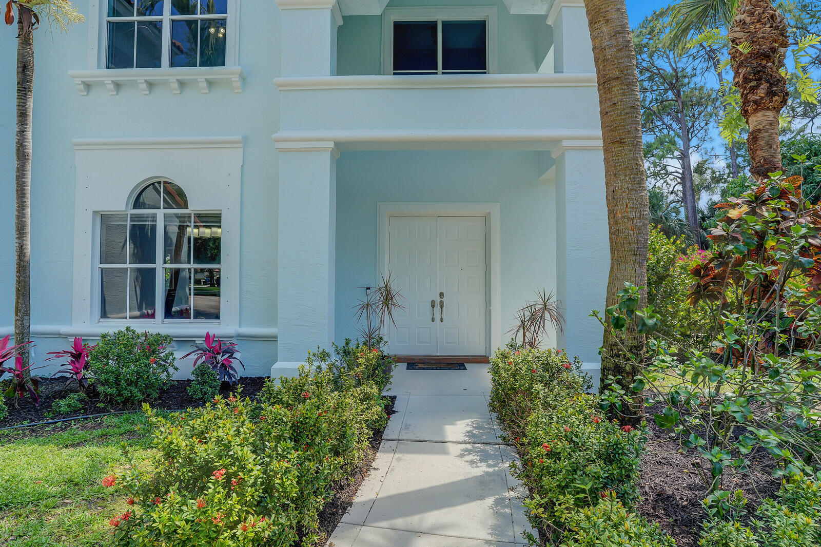 403 Mangrove Point Jupiter, FL 33458 - Photo 4 of 51 front view of a house with a yard