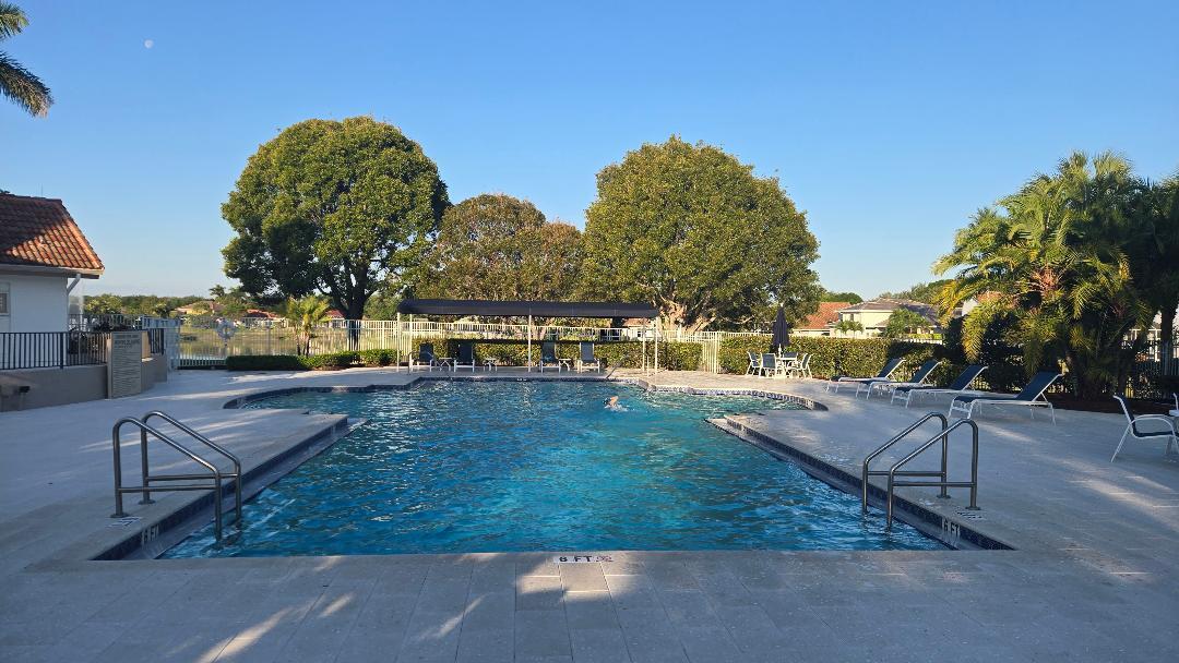 403 Mangrove Point Jupiter, FL 33458 - Photo 46 of 51 a view of swimming pool with outdoor seating and plants