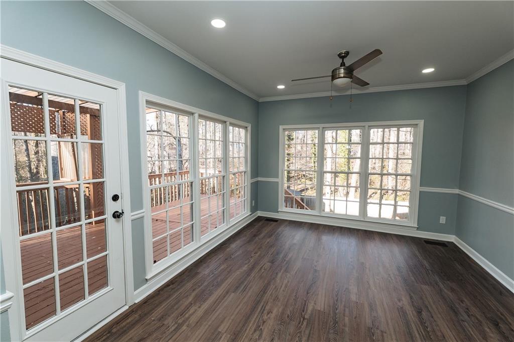 525 Rams Way Tucker, GA 30084 - Photo 19 of 41 a view of an empty room with wooden floor and a window