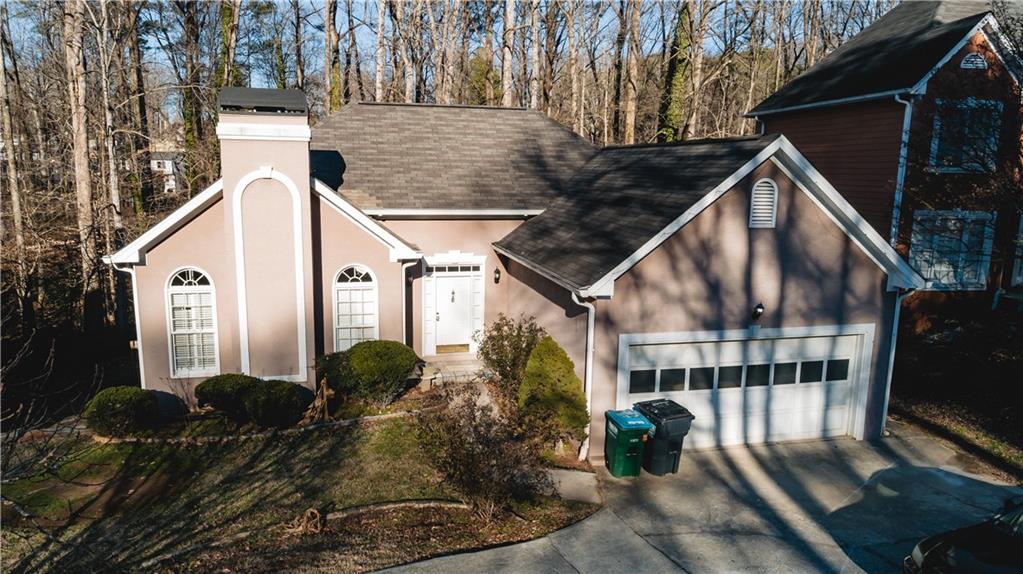 525 Rams Way Tucker, GA 30084 - Photo 3 of 41 a front view of a house with garden