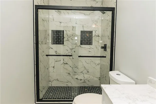 a bathroom with a bathtub and shower