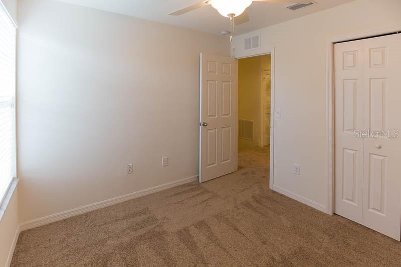 15810 Fishhawk View Drive Lithia, FL 33547 - Photo 19 of 34 an empty room with windows