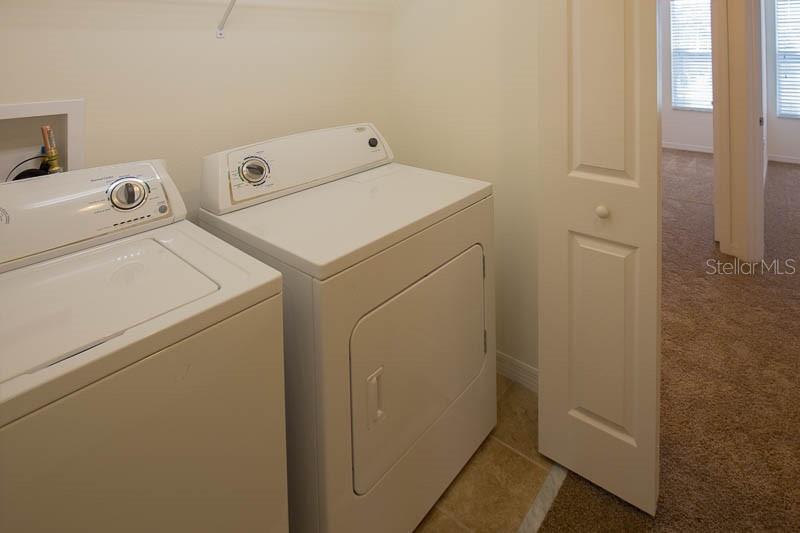 15810 Fishhawk View Drive Lithia, FL 33547 - Photo 20 of 34 a utility room with dryer and washer