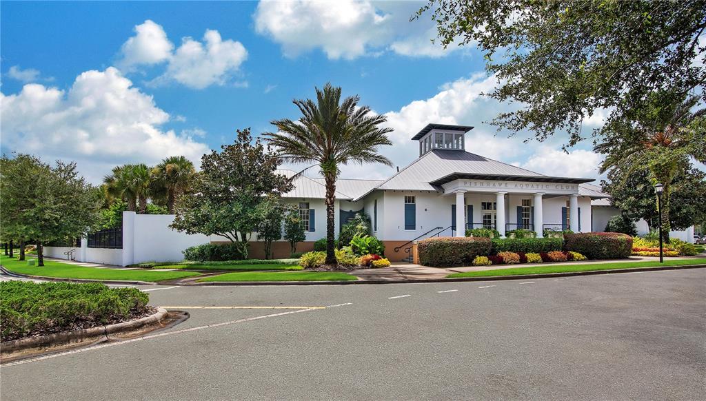 15810 Fishhawk View Drive Lithia, FL 33547 - Photo 32 of 34 a front view of a house with garden and trees