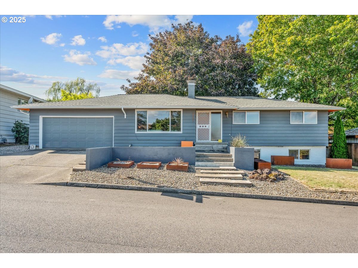 a front view of house with yard outdoor seating and barbeque oven