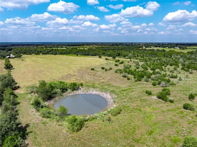 a view of a lake with a yard