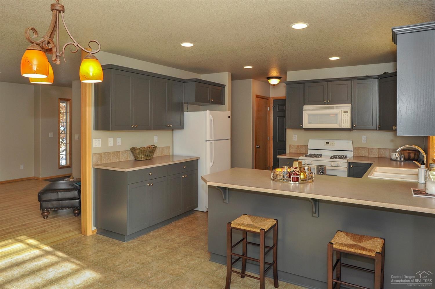 20584 Dylan Loop Bend, OR 97702 - Photo 7 of 20 Spacious kitchen that opens to the dinin