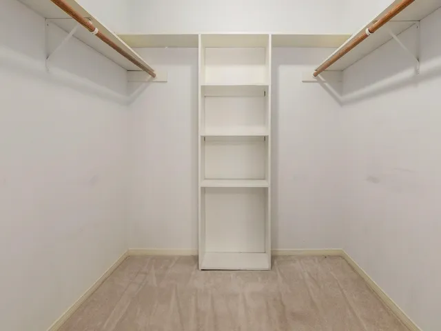 a view of an empty walk in closet