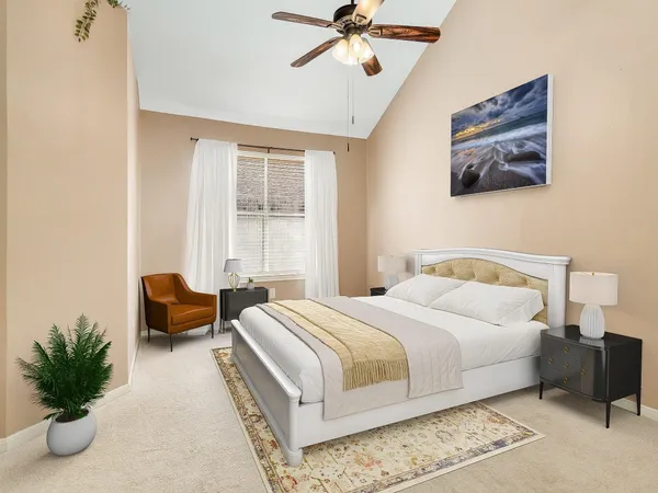 a bedroom with a bed and a couch