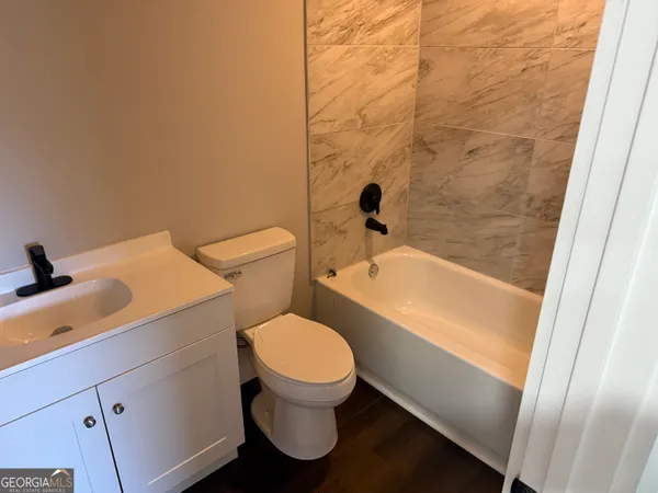 a bathroom with a sink and a toilet